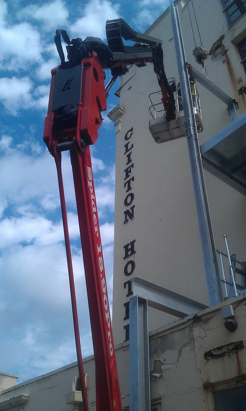 Sophie, tracked spiderlift cherrypicker from High Reaching Solutions installing new fire escape in Scarborough Malton York